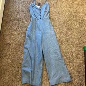 Blue Romper with adjustable straps and an adjustable tie in the back